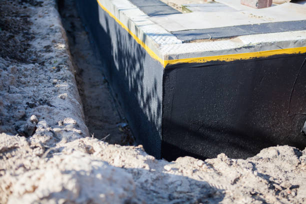 Professional Waterproofing technician working in Hamlet, NC